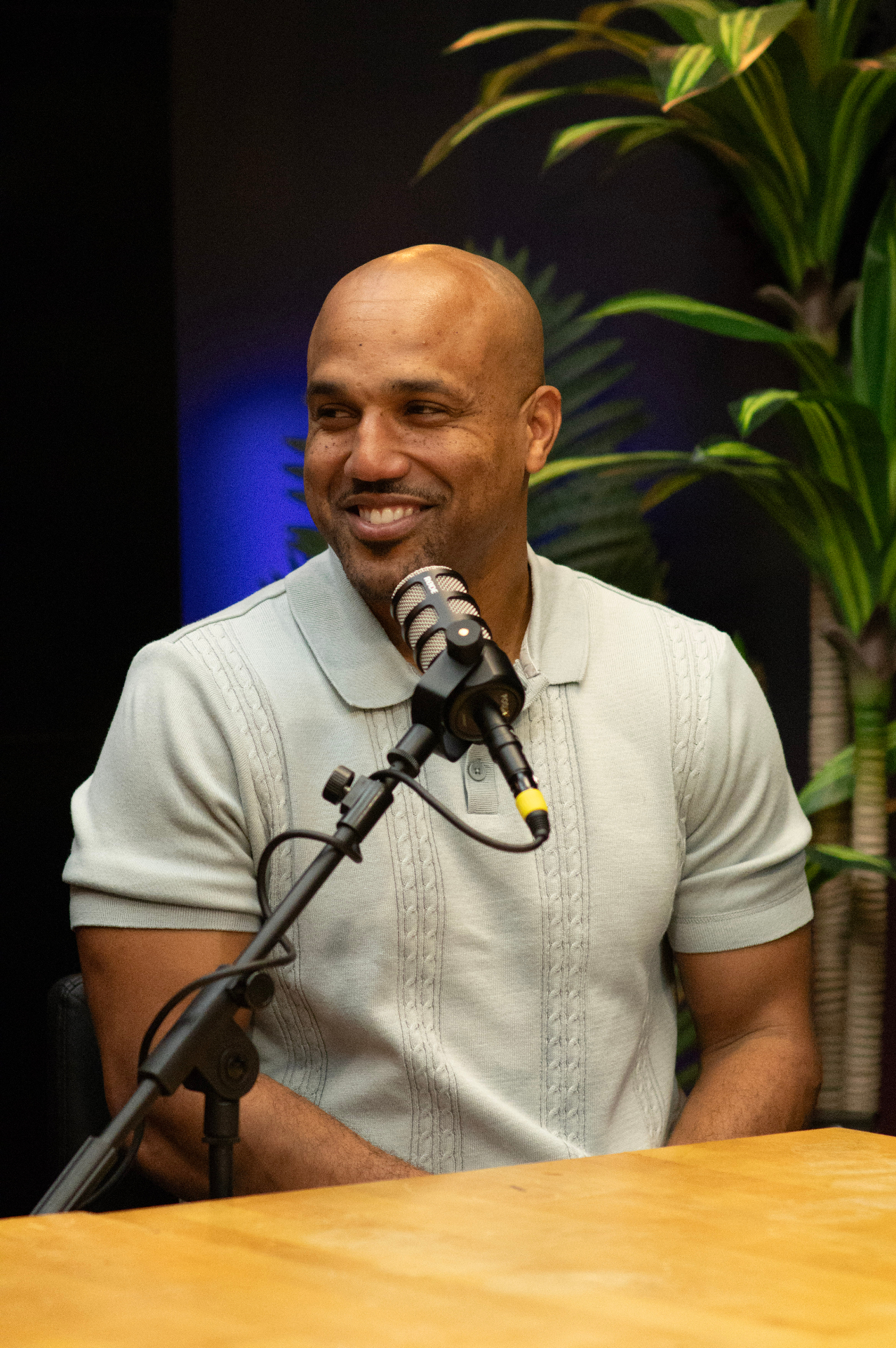 Podcast guest smiling during a branded content recording session