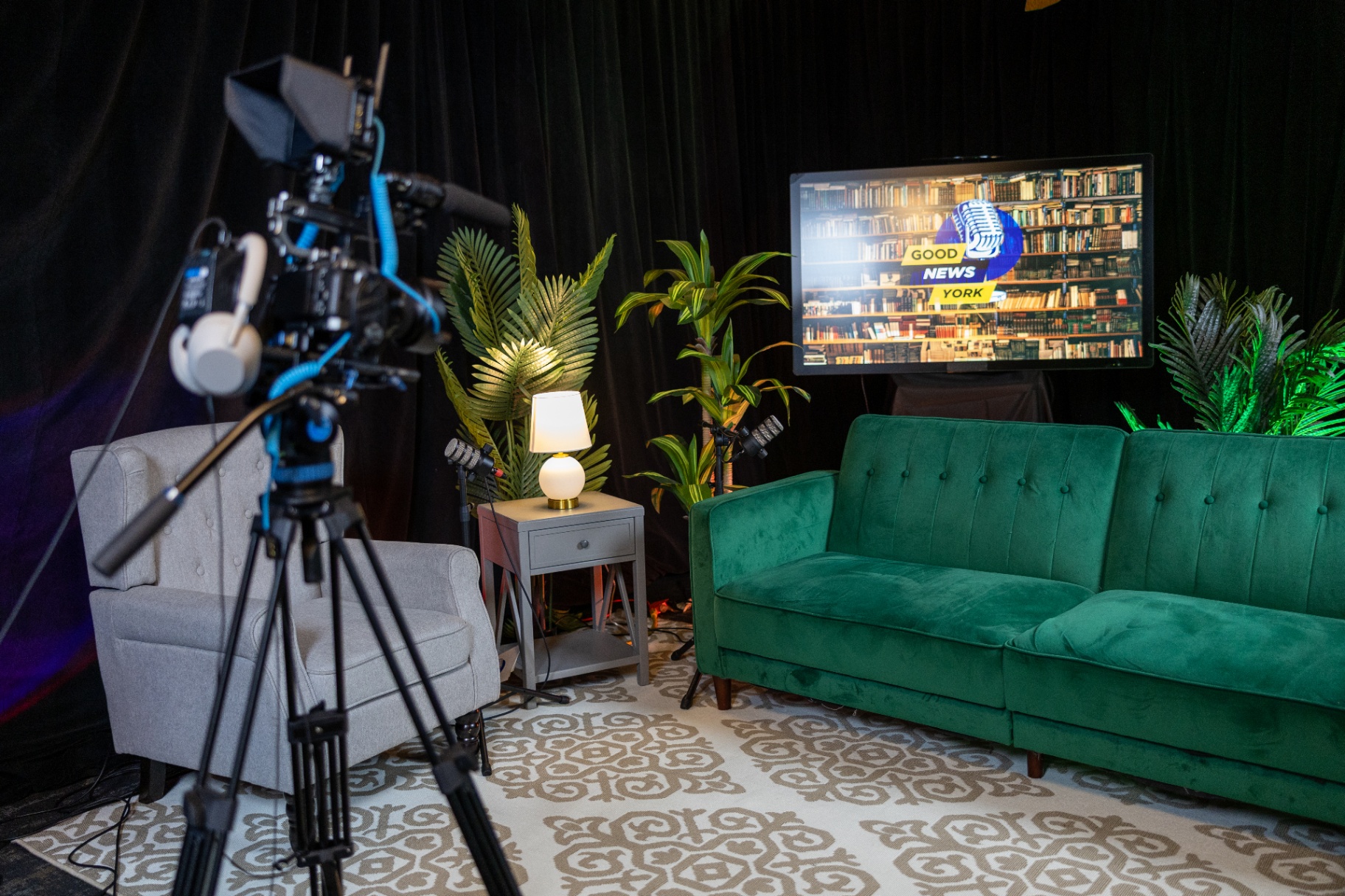 Good News York broadcast set with green velvet sofa